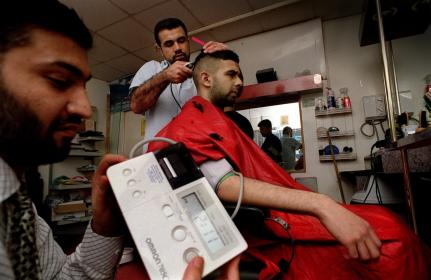 Health checks for men at a barbers’ shop in Bradford UK. © Bradford Health of Men project