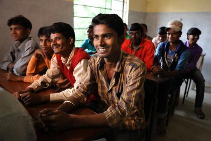 Men smiling in Raniganj, Bihar, India. © Paula Bronstein/Getty Images/Images of Empowerment