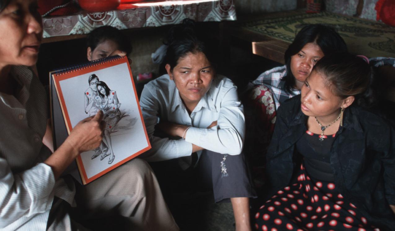 Local NGO staff teaching sex workers about the risk of HIV/AIDS. Cambodia. Photo: © Masaru Goto / World Bank