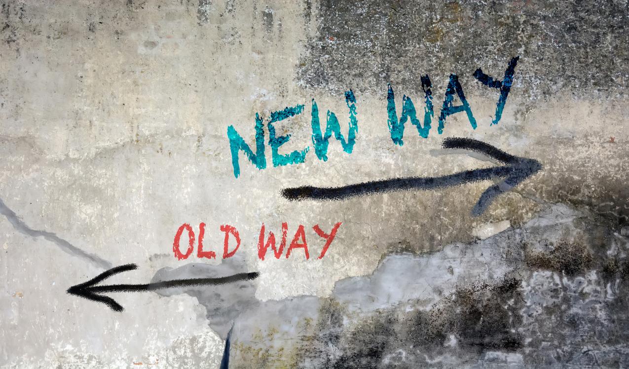 Wall Graffiti saying new way, old way with arrows. © Pixelvario/Shutterstock ID: 1409350979