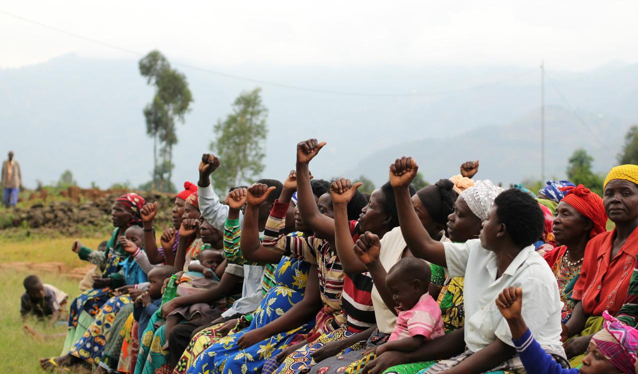 Women and children at a village meeting near Kigali, Rwanda. © Subhrajit123 / Shutterstock ID: 2011588205