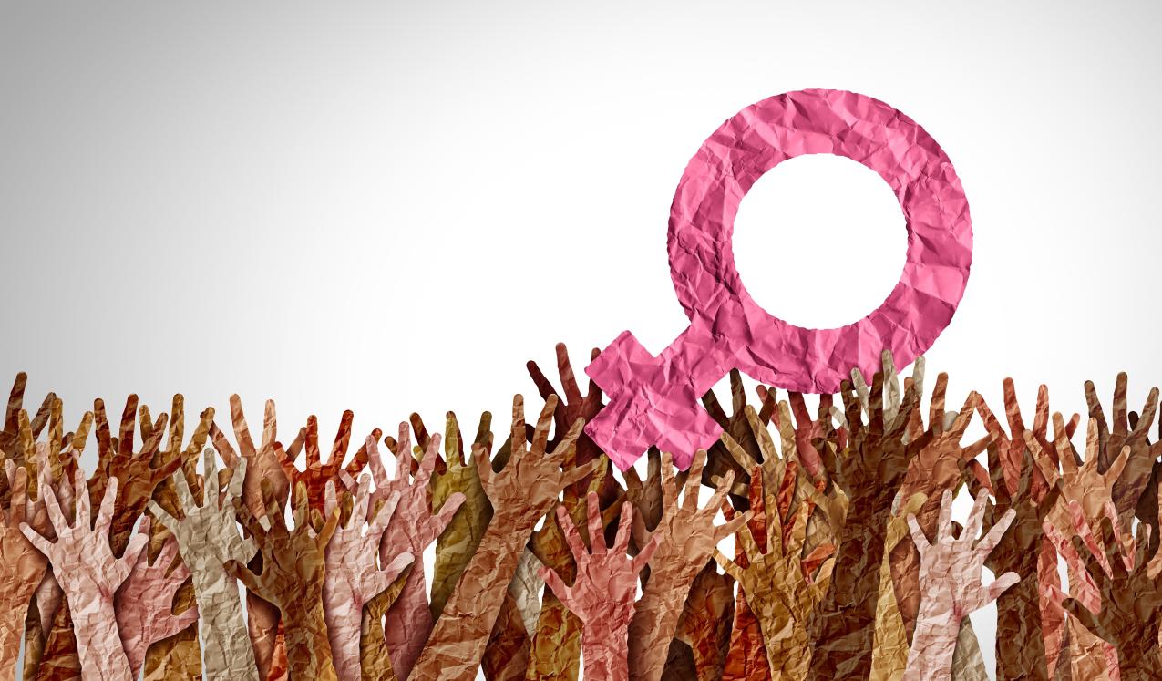 Artwork using tissue paper depicting many hands holding up the gender equality symbol. © Lightspring | Shutterstock ID: 2172065821