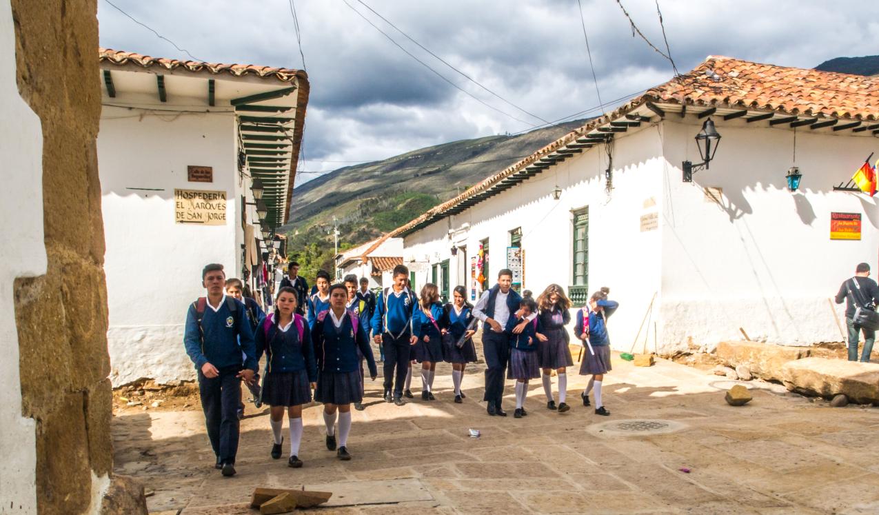 Children in school uniforms going to school in Villa de Leyva, Colombia. © Nowaczyk | Shutterstock ID: 1355817296