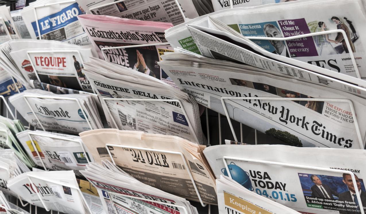 A newsstand with papers from around the world. © Copyright Lawrey| Shutterstock ID: 300273554