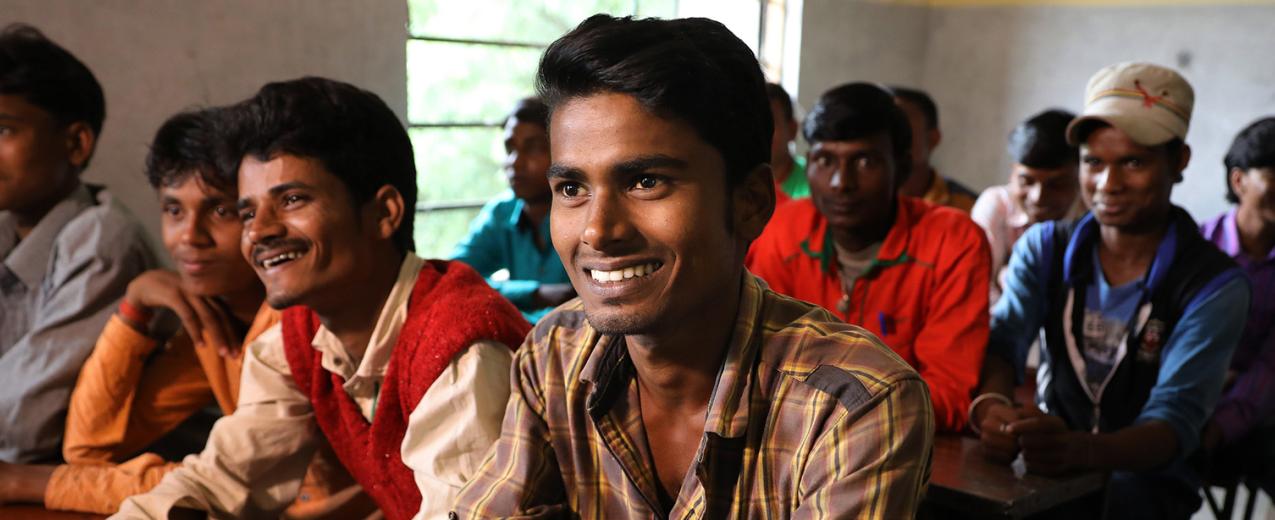 Men smiling in Raniganj, Bihar, India. © Paula Bronstein/Getty Images/Images of Empowerment