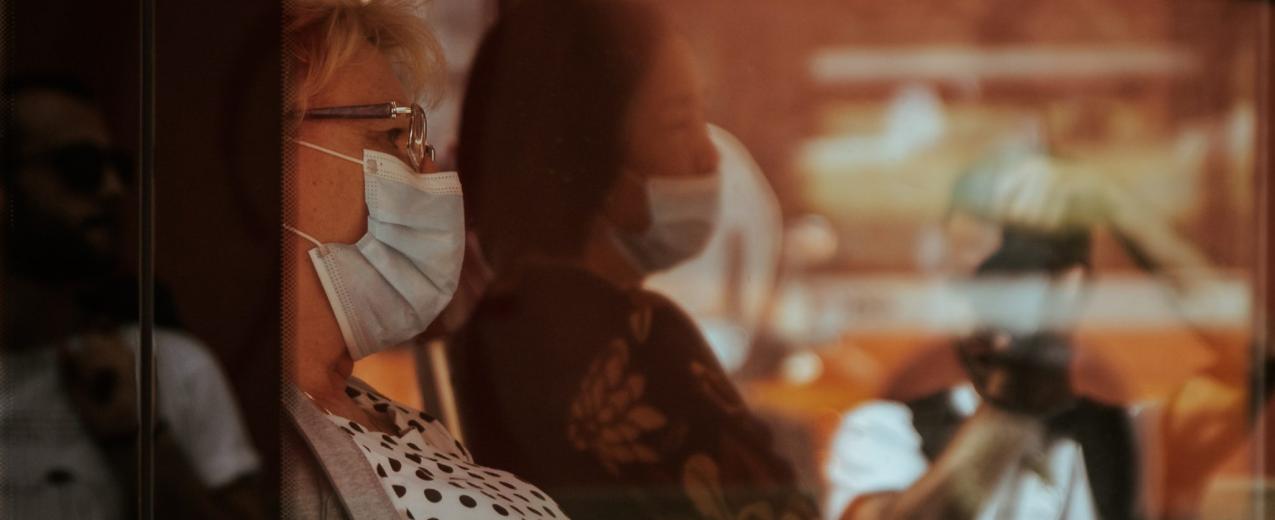 Women on a bus wearing facemasks. Credit: Gender and Covid-19 Working Group