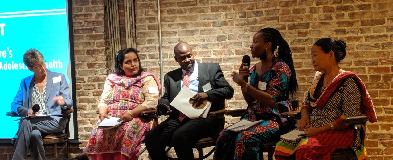 A group of panelists answer questions from the audience.