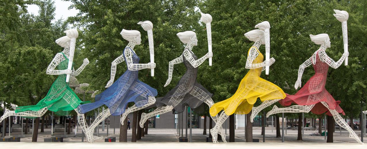 Sculptures of women running with Olympic torches in Beijing, China. © Sam Balye/Unsplash