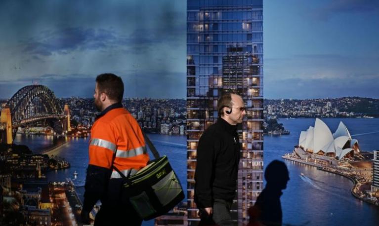 Men on their way to work. Credit: AFP