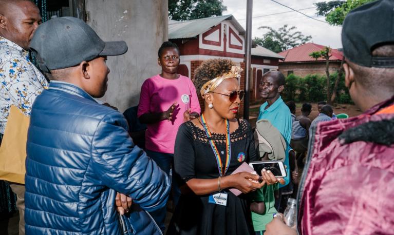 Maria Nantale, centre, at an outreach event hosted by the Aids Support Organisation, a health services group, and Uganda’s Eastern Region Women’s Empowerment Organisation. © Jake Naughton/the Guardian