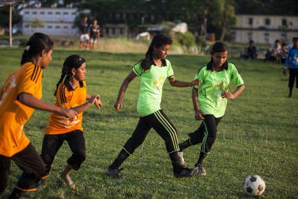 Girls playing football in Nepal