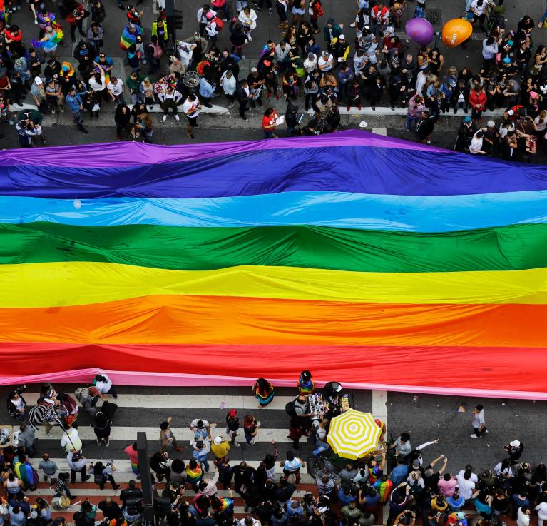 A giant rainbow being carried down the streets during the Pride parade in Sao Paulo, Brazil, 2018. © Nelson Antoine | Shutterstock ID: 1415682524
