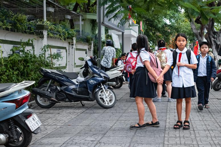 Children in uniforms walking to school in Nha Trang-March, Vietnam. ©Elena_Alex_Ferns | Shutterstock ID: 2445996523 